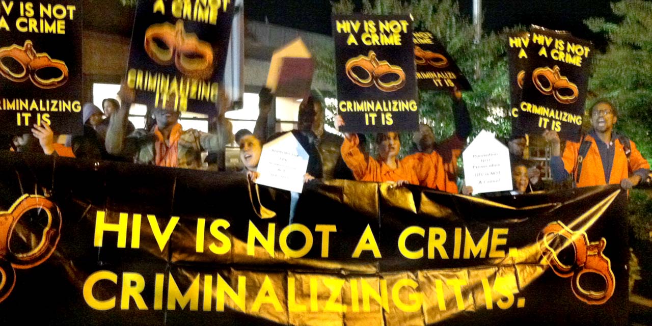 AIDS Activists Dressed In Orange Prison Jumpsuits Flood Site of Presidential Debate: Demand an End To HIV Criminalization